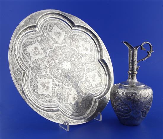A late 19th/early 20th century Persian silver salver and a white metal ewer.